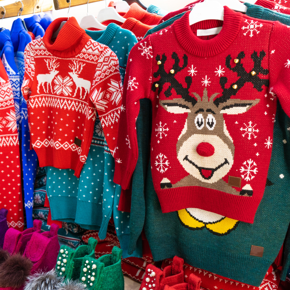 ugly holiday sweaters on display in retail shop